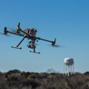 drone flying in blue sky